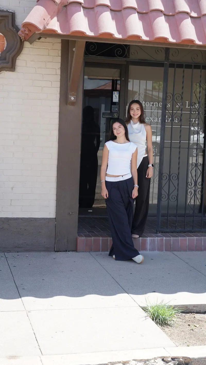 Two Traffic Tickets 915 team members standing outside the office entrance at 718 Myrtle Avenue in El Paso